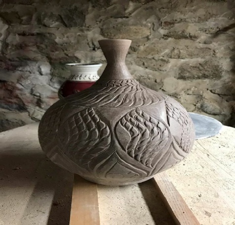 hand carved vase on a wheel thrown bottle  by Artist John Kondra